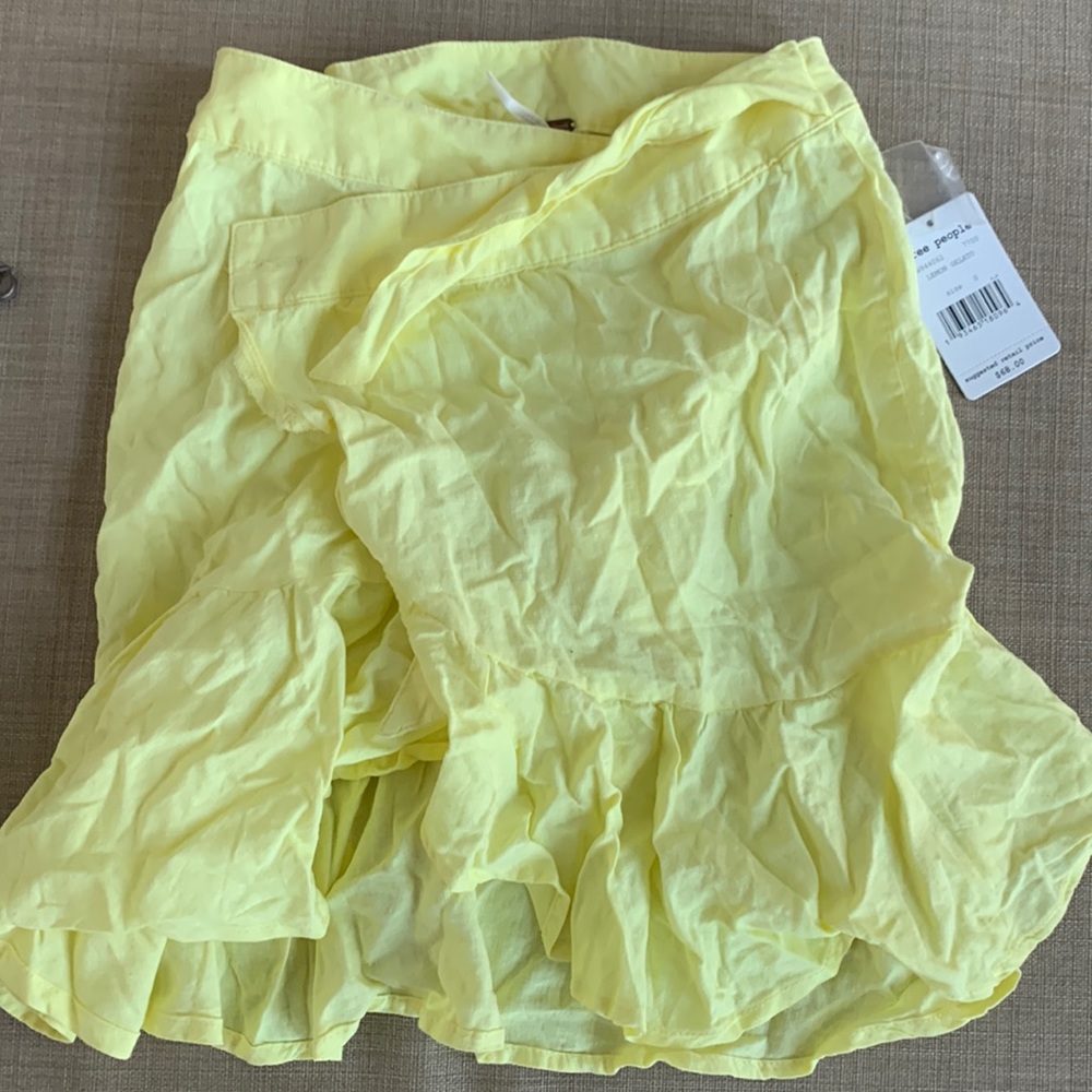 Wrapped yellow Free People skirt. Never work with tags